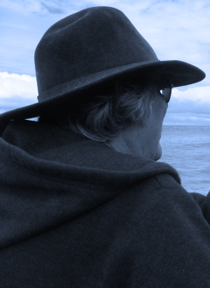 a black and white picture of Greg looking out to sea