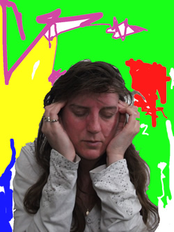 a photo of Linda in torment, hands over her ears